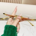 Lunettes de soleil sans monture avec branches imitation bois et détails en strass - Monture Dorée Verres Transparents