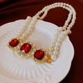 Double-strand pearl necklace with vintage gold and red crystal pendants on a dish - Square Rhinestone Double Layer Pearl Necklace (Red)