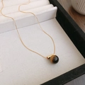 Close-up of gold plated necklace with round tiger eye pendant in a premium jewelry box - 39# Gold-Coffee