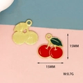 Macro detail of 15mm cherry charms in gold finish and red enamel for jewelry making - Cherry-Gold