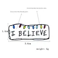 Detail view of I BELIEVE enamel pin with colorful bulbs, size 3.6cm by 1.4cm - CC516 (I Believe Lights)