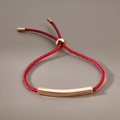 Minimalist red woven bracelet with an adjustable curved rose gold stainless steel bar - Red Rope Rose Gold