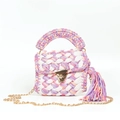 Detail of handmade woven bag featuring colorful fabric strips and golden metal lock - Purple Pink Beige Patchwork