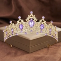Detail of golden Baroque crown with purple teardrop crystals and rhinestones in gift box - Gold with Purple Zircon