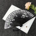 Classic black folding fan with white and green floral butterfly patterns and black tassel - Cherry Blossoms Falling - Black Handle