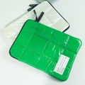 Close-up of green and white quilted space cotton laptop sleeves with soft padded texture - 13-14 Inch Laptop Bag / Green