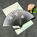 Classic folding fan with black ribs, grey peony ink painting and silk tassel accessory - Elegant Peony - Black Handle