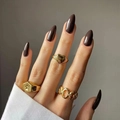 Three gold signet rings with heart and star patterns shown with deep brown nails - Dark Brown (JP2135)