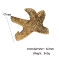 Vista dettagliata del bracciale a fascia stella marina oro 18k con dimensioni 47mm e 65mm - Oro