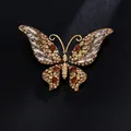 Elegant butterfly brooch in gold-tone alloy with amber rhinestones and clear crystals - Champagne Butterfly Style (XD10854-4)