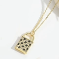 Golden heart envelope locket necklace featuring a black and white checkerboard design - Black Lock
