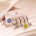Silver stainless steel earring set with evil eye and animal charms on a display card - Multicolor Evil Eye Elephant Set