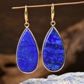 Teardrop lapis lazuli earrings with golden hooks hanging on a wooden branch - E1910 / Long Water Drop