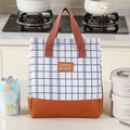 Checkered black and white insulated lunch bag with brown handles and waterproof fabric - Brown