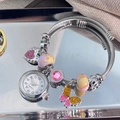 Silver beaded bracelet watch with pink heart and butterfly charms on a tray - Silver Pink Bead Bangle