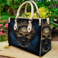 Black PU leather tote bag featuring a gothic blue and gold skull print with handles - Baroque Skull 0053