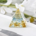 Blue crystal chips Orgone pyramid with golden metal coil and resin finish - Deep Sea Aquamarine