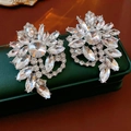 Macro detail of silver flower earrings with sparkling rhinestones on green jewelry box - Large Floral Style / Silver (Silver Pin)