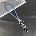 Detail of royal blue rhinestone phone lanyard with silver metal clasp on black background - 6mm Rhinestone Pendant / Sky Blue (K3127)