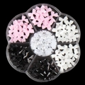 3D nail charms set with pink white black bows and pearls in a transparent grid box - Trending Style 3