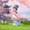 Macro shot of ancient Chinese lady figurine with flower basket in a garden - Xi Shi Figurine Large