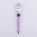 Close-up of purple beaded pen with cartoon skull silicone topper and glitter finish - Purple Monster