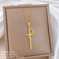 Macro shot of gold cross pendant with crystals in jewelry box on white silk cloth - Gold Cross (A536)