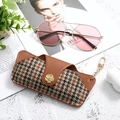Portable brown houndstooth leather glasses case with a gold flower snap and hook - Houndstooth Colorful