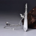 Macro detail of hexagonal clear crystal pendant with ornate silver cap and wing charm - Silver Amethyst