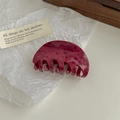 Detailed view of a dark burgundy marble pattern claw clip on white textured paper - Dark Wine Red Marble Claw