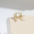 Eleganti orecchini a fiocco dorati con cristallo a cuore su pietra decorativa - Nodo a Cuore (Oro)