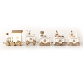 Detail view of white and gold wooden Christmas train with miniature bears and snowmen - White Gold