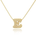 Macro shot of gold box chain and letter E pendant set with sparkling clear zircons - Letter E