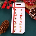 Detail of 7 pairs of Christmas earrings including trees, reindeer, and candy canes - 06 Cane Gingerbread Man Set