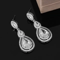Macro shot of silver drop earrings with triple-layered pear-shaped sparkling crystals - Three Layer Water Drop Dangle (KS48)