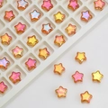 Macro shot of 8mm star-shaped gradient glass crystal beads in a white organizer box - Gold Rose Red