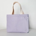 Detail of light purple canvas tote bag featuring cream webbing handles and fabric texture - Open Top / Purple