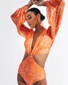 Detail of long sleeve orange swimsuit with coral print and stylish side cut-outs - S / Orange Red