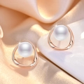 Elegant rose gold pearl stud earrings with sparkling cubic zirconia on silk background - Rose Gold Streamline Pearl Stud Earrings (C15)