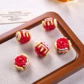 Detail of five red cake-shaped oil beads with heart patterns for DIY jewelry making - Red Red Cream Yellow Edge Pink Heart