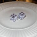 Macro shot of cubic zirconia cube earrings on a textured white ceramic plate with sharp detail - Geometric Square (WE3424) / Silver-Purple Main Stone