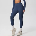 Detail view of seamless dark blue high-waisted yoga pants with brushed texture for fitness - 7100 Trousers - Badge Blue / S