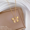Macro shot of titanium butterfly necklace with pink crystals and dimensions 2.1x1.7cm - Butterfly Necklace (Titanium Chain Copper Pendant) / Gold
