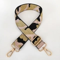 Macro detail of adjustable camouflage bag strap with gold metal hardware and hook - Pink Gold Thread + Gold Buckle