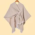Detail of beige knit shawl featuring thick warm fabric and white fringe trim edges - White Fringe with Stripe / Khaki