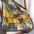 Elegant silk scarf featuring pelican and geometric patterns in mustard and navy tones - Navy Yellow