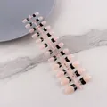 Short square-oval nude press-on nails with black French tips on a display strip - French Black Tip Short Square Glossy (DF-MP02)