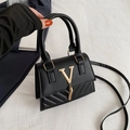 Chic black PU leather handbag with golden V logo, tassel decor and quilted texture - Black