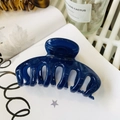 Detail view of a large navy blue high-gloss hair claw clip on a white magazine background - Keel Style Claw / Approx 11cm / Jelly Royal Blue