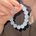 Exquisite beaded bracelet with light blue round pearls on hand for elegant women - S070-12mm Bracelet [icy Blue] Glass Material #sz557